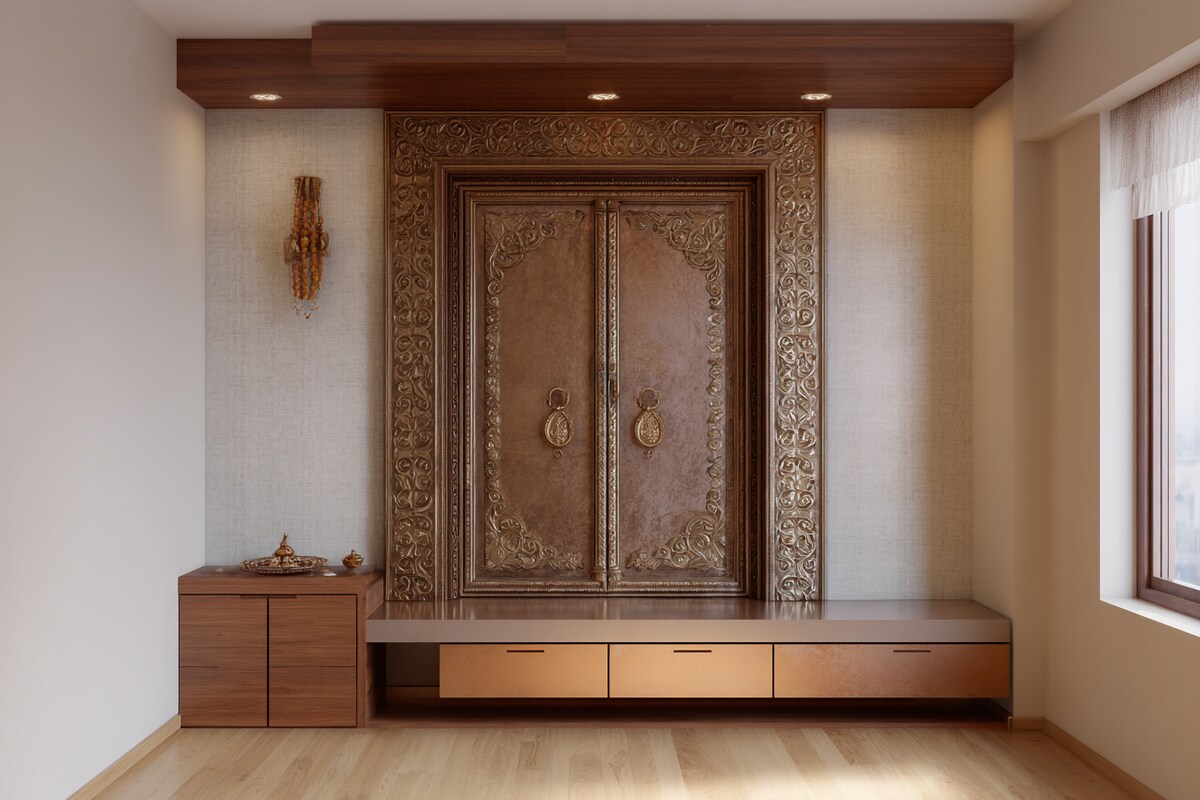 Modern Pooja Room Design With Engraved Metal Door