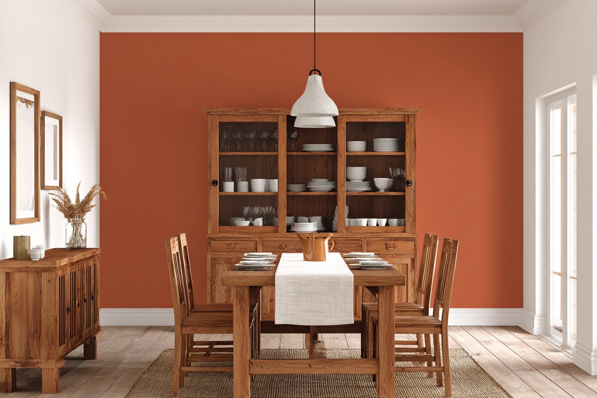 Bold Terracotta and White Wall Colour Combination for Dining Room with Wooden Hutch and Woven Runner